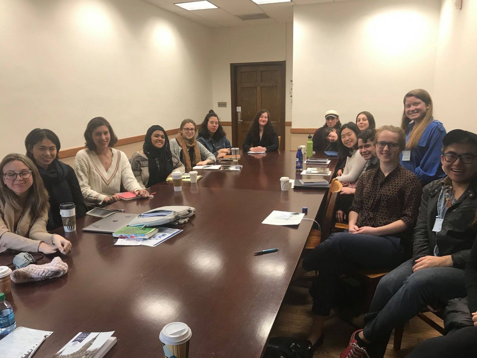 Students around a conference table at the ACLA 2019 Annual Meeting.